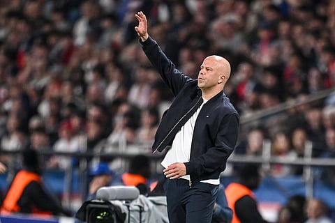 Arne Slot gestures from the touchline against PSG
