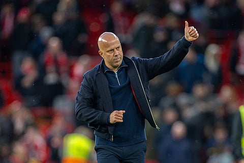 Arne Slot gives a thumbs up to the Anfield crowd at full-time