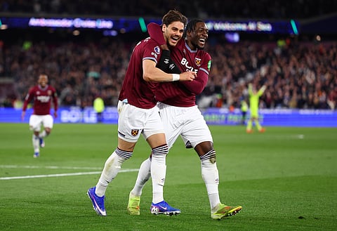 Konstantinos Mavropanos celebrates his goal with Axel Disasi