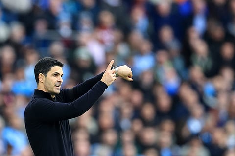 Mikel Arteta signals to his players during Manchester City game