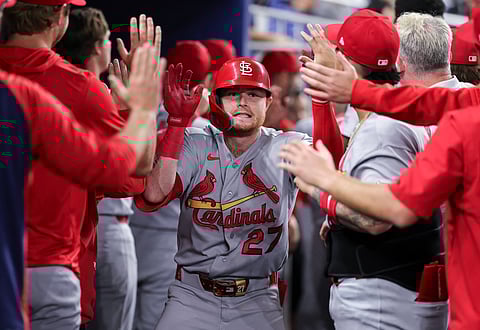 Nathan Church celebrates his run with teammates