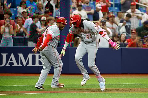 Cincinnati Reds players celebrate after a homer