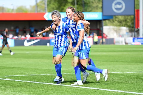 Madison Haley celebrates her goal with teammates