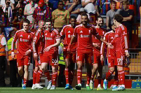 Andy Robertson celebrates his goal with teammates