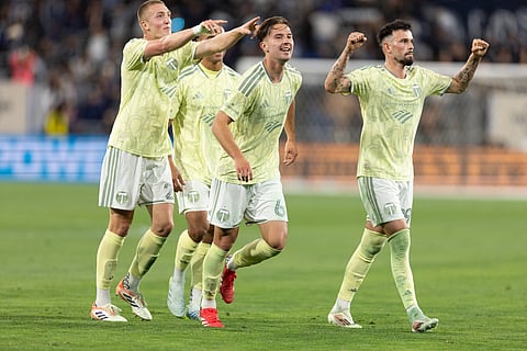 Portland Timbers players celebrate a goal against San Diego FC