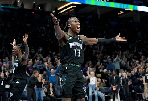 Ayo Dosunmu celebrates against Denver Nuggets
