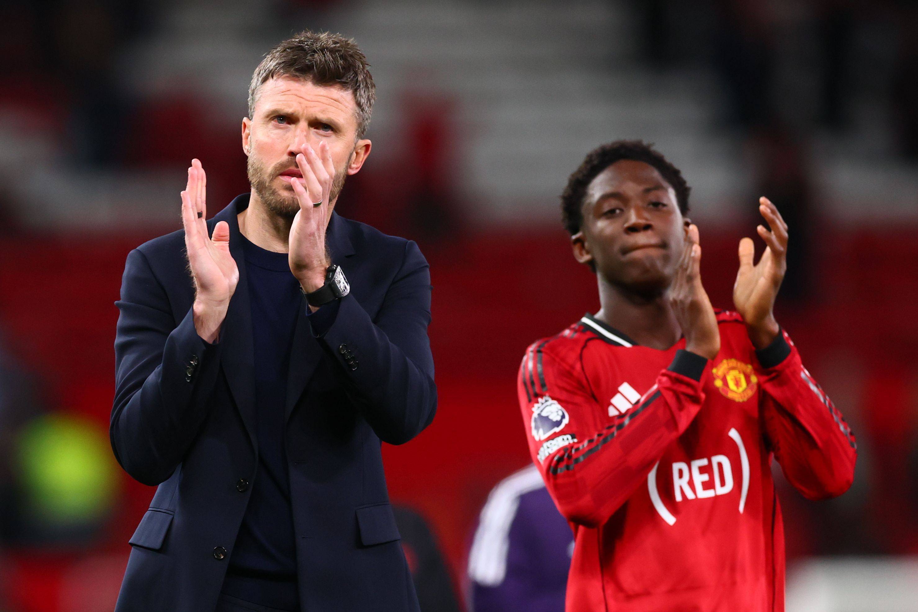 Michael Carrick with Kobbie Mainoo at full-time