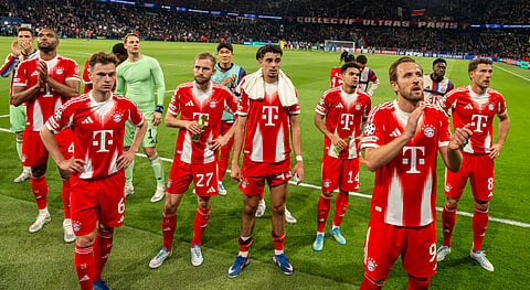 Bayern Munich players applaud the away fans at full-time