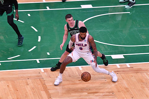 Philadelphia 76ers and Boston Celtics players in action