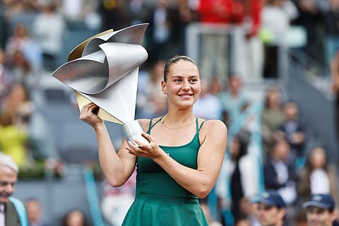 Marta Kostyuk poses with the Madrid Open Title