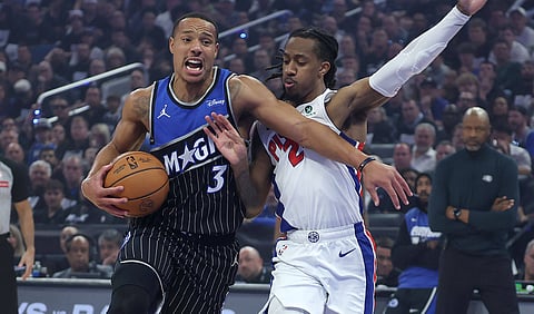 Orlando Magic and Detroit Pistons players in action