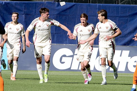 Louis Munteanu celebrates his goal with teammates