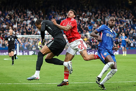Morgan Gibbs-White collides with Chelsea goalkeeper Robert Sanchez