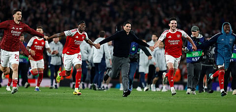 Mikel Arteta celebrates at full time with his players