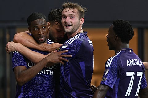 Orlando City players celebrate a goal