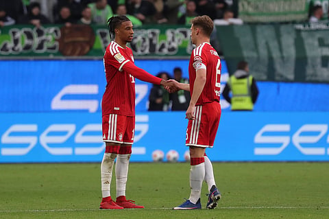 Michael Olise celebrates his goal with Joshua Kimmich