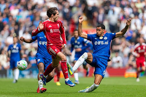 Chelsea and Liverpool players in action during PL clash