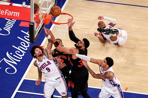 New York Knicks and Philadelphia 76ers players in action