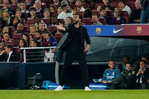 Alvaro Arbeloa reacts from the touch during the El Clasico