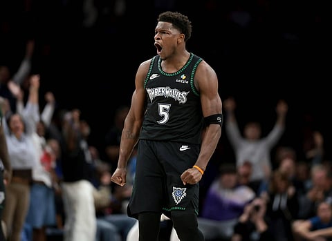 Anthony Edwards reacts after hitting a three-pointer