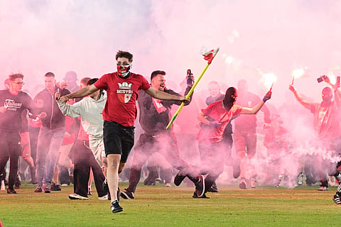 Slavia Prague fans invade the pitch during the Prague derby