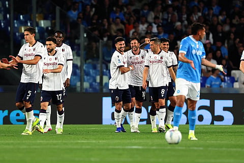 Bologna players celebrate their goal against Napoli