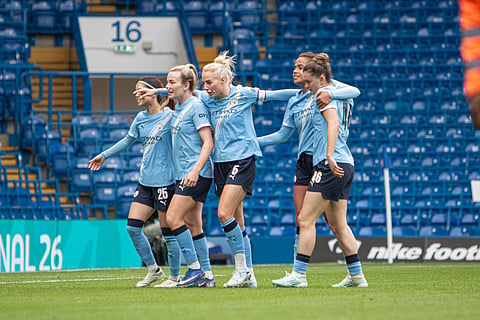 Manchester City players celebrate their win