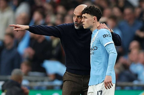 Pep Guardiola with Phil Foden
