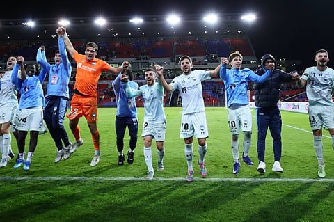 Sydney FC players celebrate as they advance to the A-League final