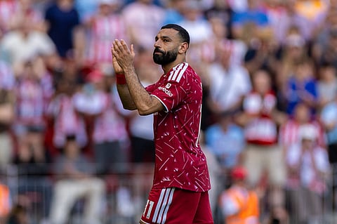 Mohamed Salah applauds the Anfield crowd for one final time