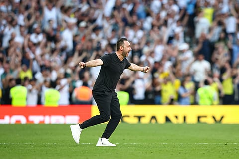 Roberto De Zerbi celebrates at full-time against Everton