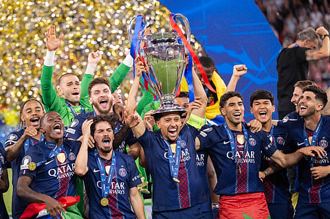 PSG players pose with the UCL trophy