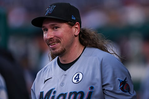 Miami Marlins pitcher Lake Bachar smiles in the dugout