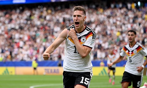 Nico Schlotterbeck celebrates his goal for Germany