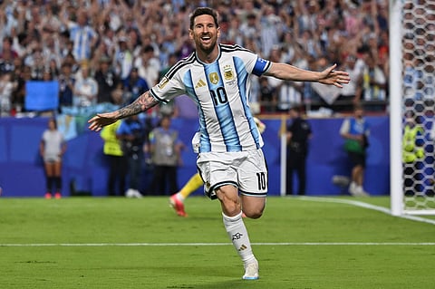 Lionel Messi celebrates his goal against Algeria