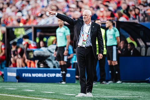 Graham Arnold on the touchline against Norway