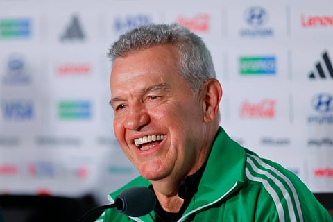 Javier Aguirre smiles during the pre-match press conference