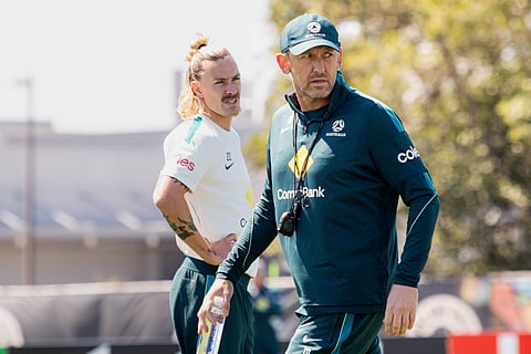 Tony Popovic with Jackson Irvine during training session