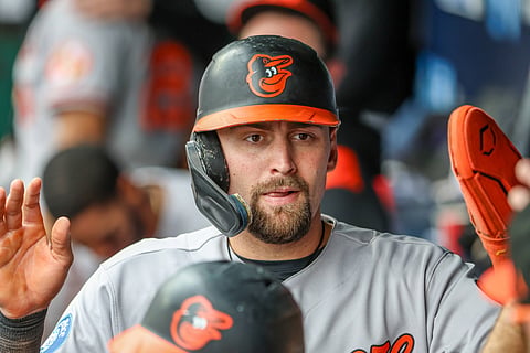Colton Cowser of Baltimore Orioles celebrates in the dugout