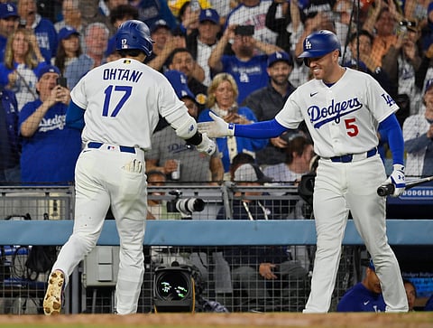 Shohei Ohtani and Freddie Freeman celebrate a home run