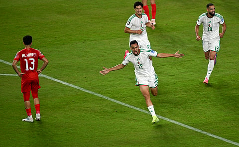 Nadhir Benbouali celebrates his winning goal against Jordan