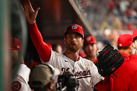 Foster Griffin high fives a teammates after win over Phillies