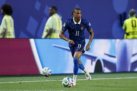 Michael Olise of France in action