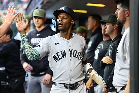 Jazz Chisholm Jr. is congratulated in the dugout