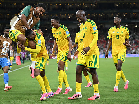 Thapelo Maseko celebrates his winning goal with teammates