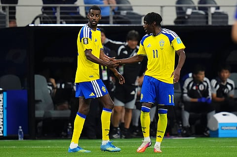 Alexander Isak congratulates Anthony Elanga after his equaliser against Japan