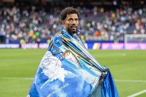 Vozinha seen with the Cape Verde fans after advancing to the Round of 16 of the FIFA World Cup