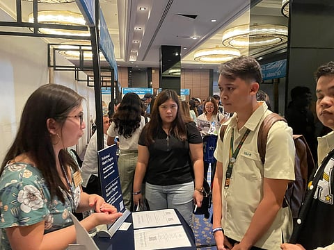 A Biology student from the University of San Jose Recoletos asks about education offerings from Yale University School of the Environment on Thursday, Oct. 12, 2023.