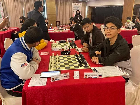 THE LEADER. Filipino Fide Master Christian Gian Karlo Arca, who hails from Panabo City, right, shares the lead in the Eastern Asia Juniors and Girls Chess Championship 2023 open division at the Sabah Oriental Hotel in Kota Kinabalu, Sabah, Malaysia on Monday, December 4.