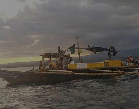 ZAMBOANGA. Authorities arrest four crewmen while their fishing boat confiscated after they were caught fishing illegally near Pitas Island, Bolong, Zamboanga City, on Wednesday, December 13. A photo handout shows the arrested crewmen and their fishing heading towards the shore of Bolong village.